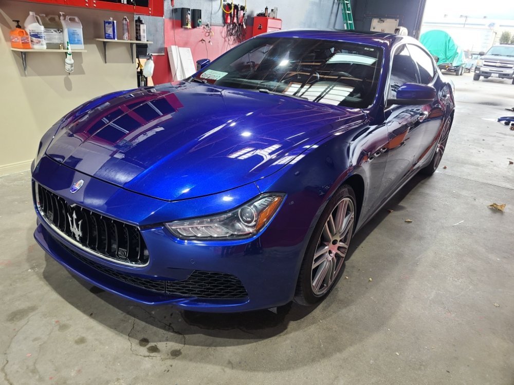 Blue Maserati Ghibli with a deep wet gloss after full detail