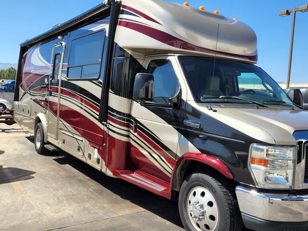 Class A motorhome at the shop for detailing and tint