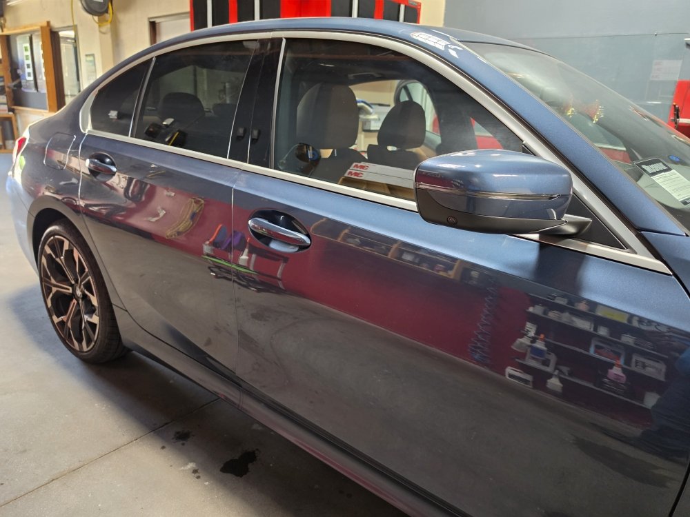 Vehicle with freshly installed window tint at the shop