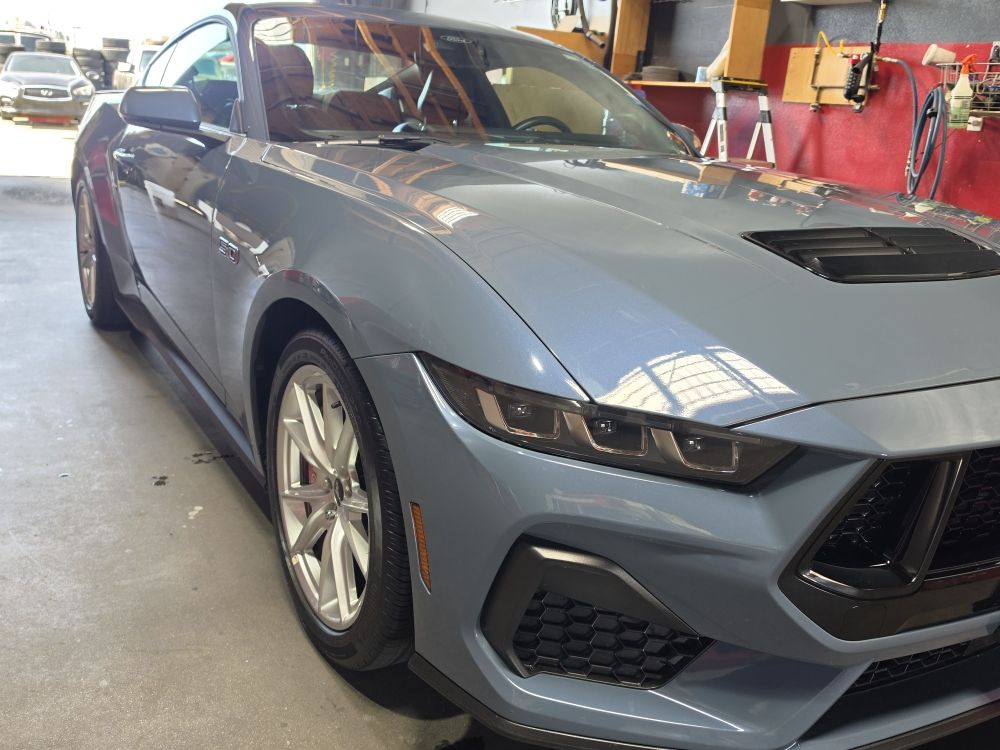 Gray Ford Mustang in the shop