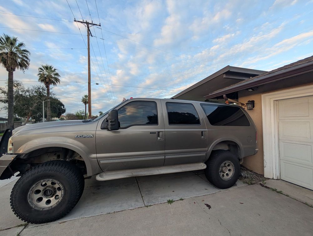 Lifted gray pickup in the driveway