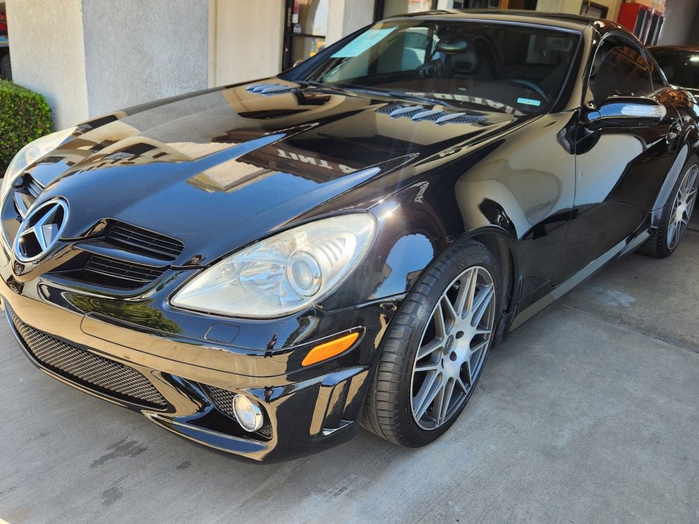 Black Mercedes coupe with gold accents