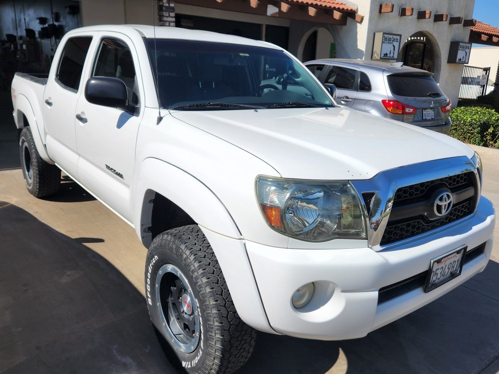 White Toyota Tacoma at the shop