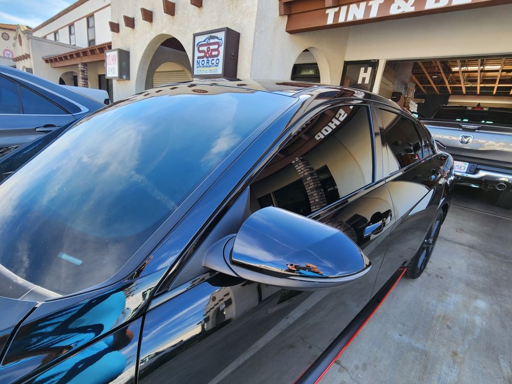 Vehicle with freshly installed window tint at the shop