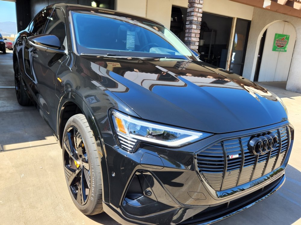 Vehicle with freshly installed window tint at the shop
