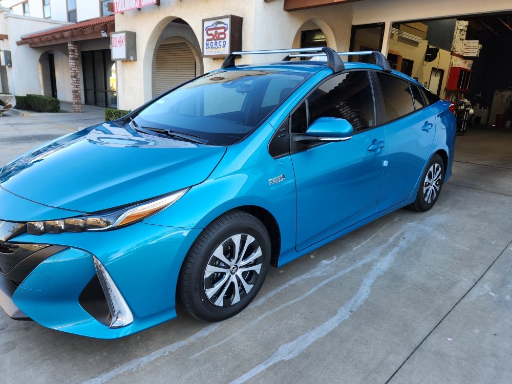 Blue Prius Prime outside the shop