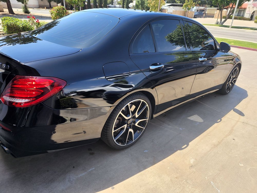 Vehicle with freshly installed window tint at the shop