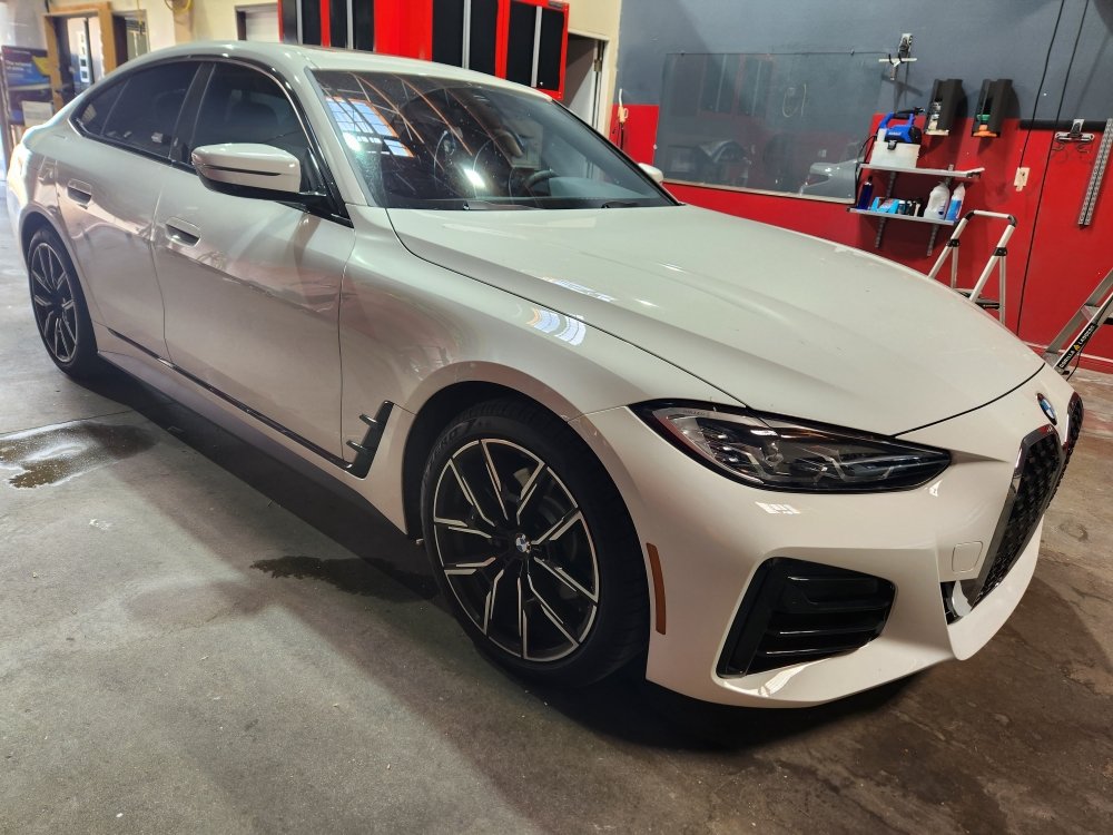 White BMW 4 Series gran coupe at the shop
