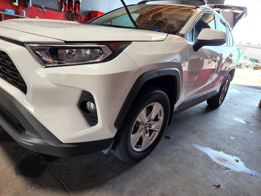 Vehicle with freshly installed window tint at the shop