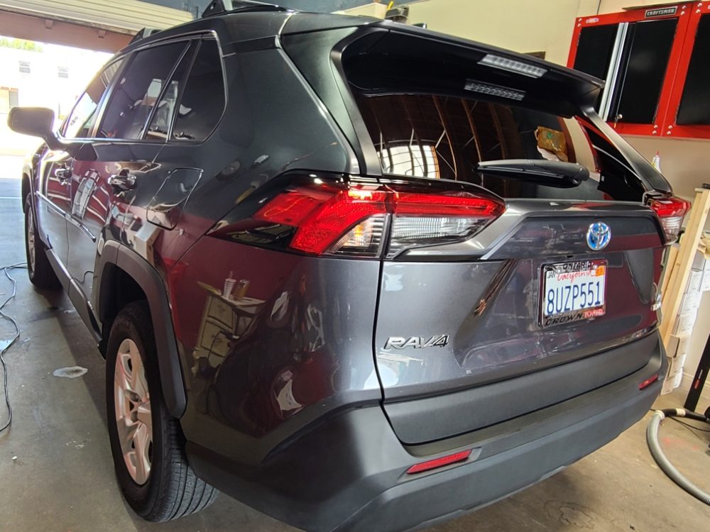 Vehicle with freshly installed window tint at the shop